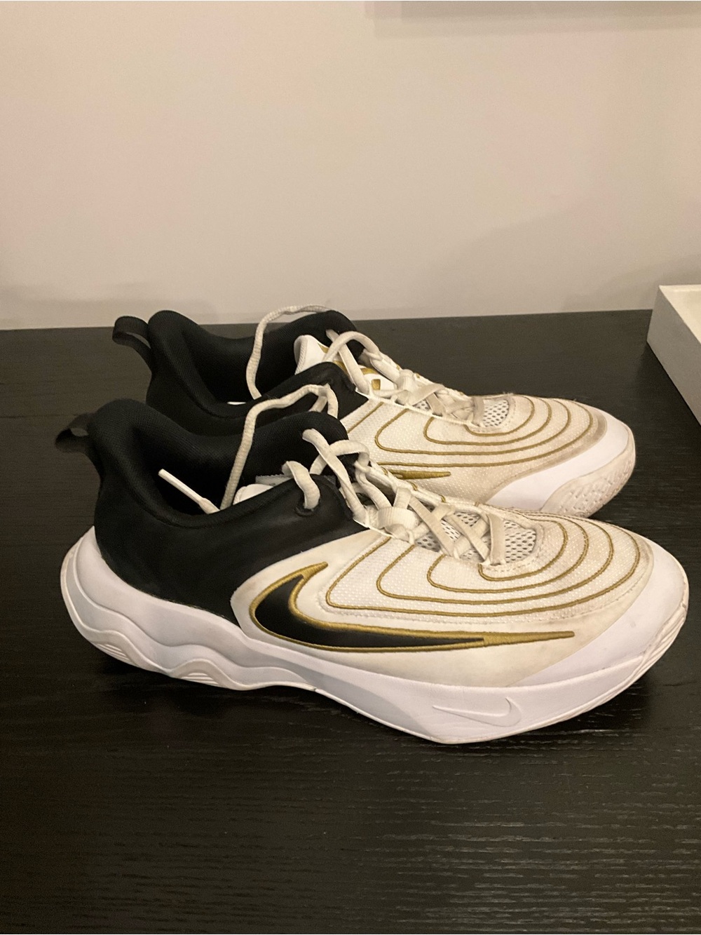 Nike Kids White and Black Sneakers with Gold Swoosh